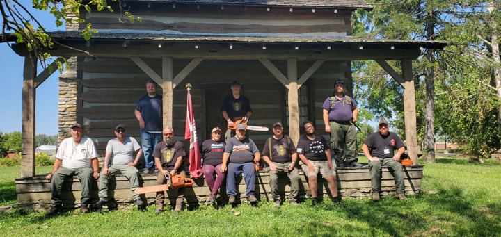 American Regulators team members on a cabin porch