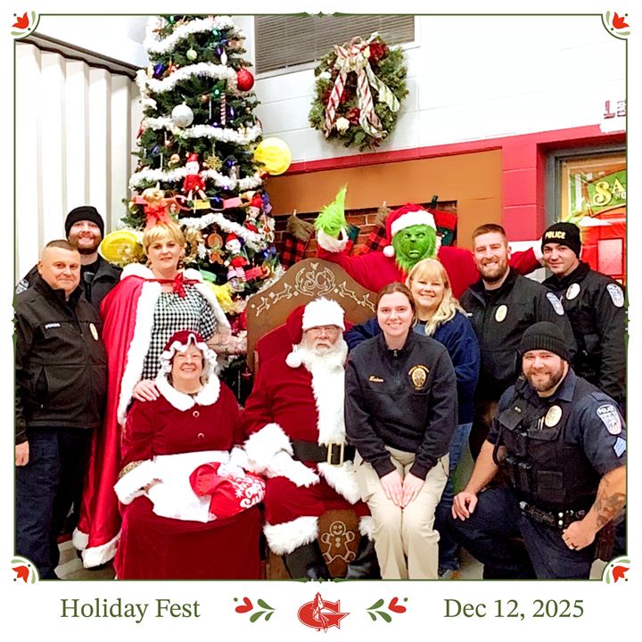 Team members with local police, firefighters and Santa at Holiday Fest, December 12, 2025