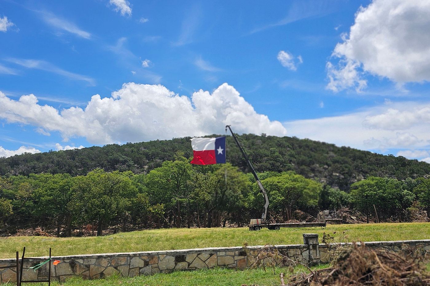 Texas flag on a hillside