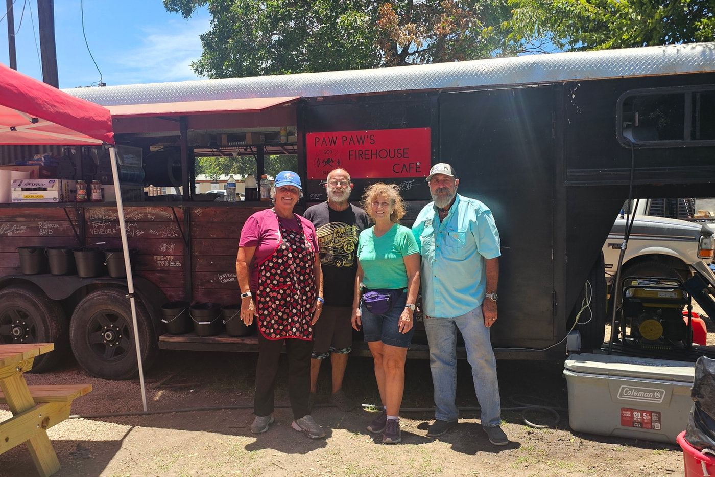 Volunteers at a supply trailer